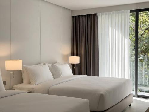 En eller flere senge i et værelse på POR Kotchasarn