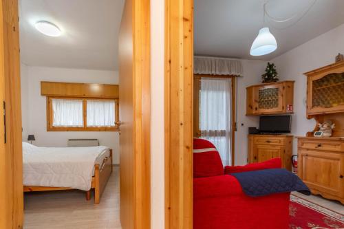 Giường trong phòng chung tại Appartamento Cordevole PT