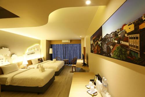 Ένα ή περισσότερα κρεβάτια σε δωμάτιο στο Hatyai Signature Hotel