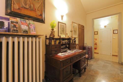 a room with an old fashioned radiator and a desk at Hotel Villa Liana in Florence