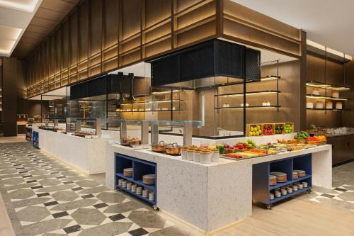 a large kitchen with a lot of food on display at Four Points by Sheraton Amritsar, Mall Road in Amritsar