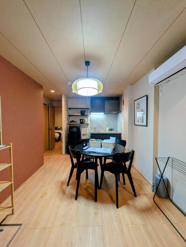 a dining room with a table and chairs in a room at LinksHotel上野 in Tokyo