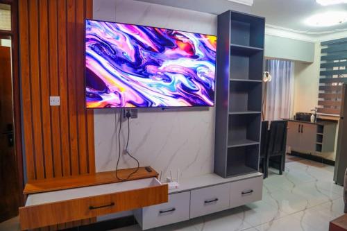 Et tv og/eller underholdning på Sunset Statehouse View Residence