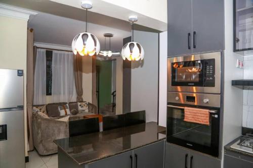 Køkken eller tekøkken på Sunset Statehouse View Residence