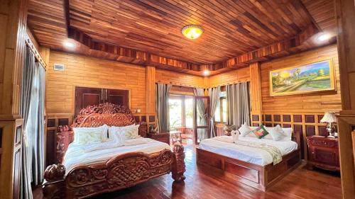 En eller flere senge i et værelse på Ratanakiri Phum Khmer resort