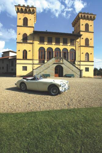 a white car parked in front of a building at Agriturismo I Bonsi in Reggello