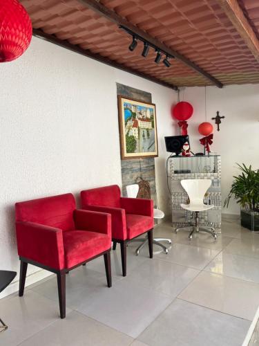 Ein Sitzbereich in der Unterkunft Pousada Casa Grande