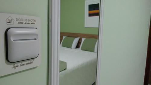 Ένα ή περισσότερα κρεβάτια σε δωμάτιο στο Domus Hotel Torre - Canaã dos Carajás