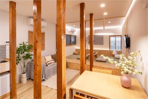 a living room and dining room with a couch at Room Inn Lu Lu Lu 横浜中華街 Room1-A in Yokohama