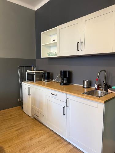 Køkken eller tekøkken på Centrum Kupiecka Apartment