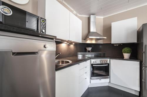 Virtuvė arba virtuvėlė apgyvendinimo įstaigoje Kalajoki Apartments