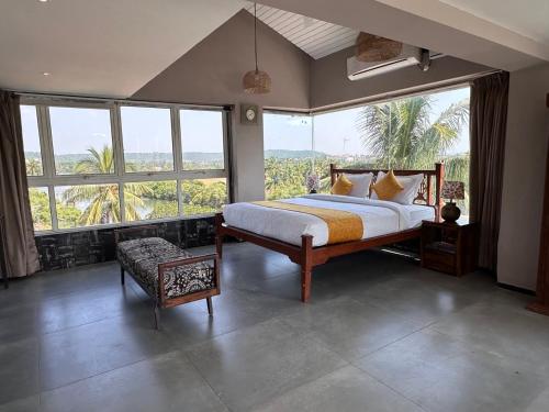 En eller flere senge i et værelse på Vibes Inn Baga