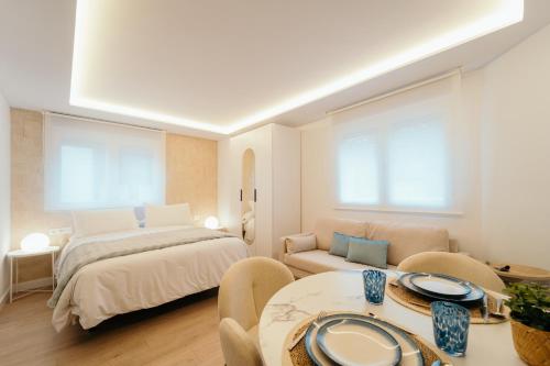 En eller flere senge i et værelse på Fuente H2