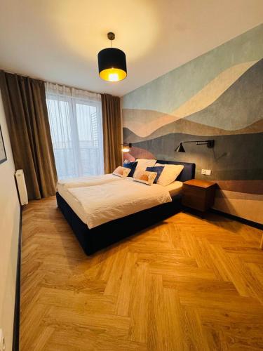 En eller flere senge i et værelse på AparatmentySnu, Dębowa I