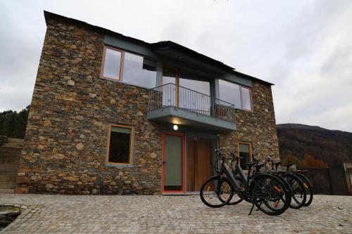 a group of bikes parked in front of a building at MedronHouse - Casa de Campo in Vasco Esteves de Baixo