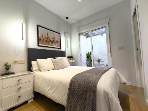 En eller flere senge i et værelse på Casa Pescadores Torrevieja