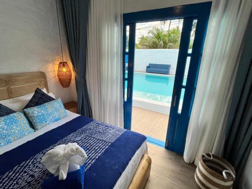 En eller flere senge i et værelse på Casa Bella Khaolak