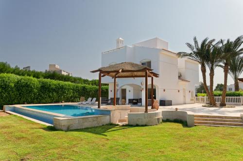a villa with a swimming pool and a gazebo at VESTA - El Gouna Residence in Hurghada