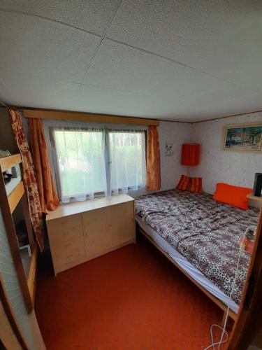 Postel nebo postele na pokoji v ubytování Chata Doksy Máchovo jezero