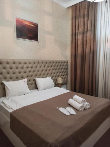 เตียงในห้องที่ Carpe Diem Boutique