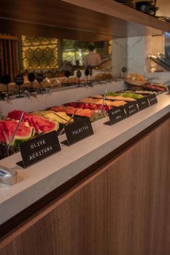 a buffet line with many different types of food at Binn Hotel in Medellín