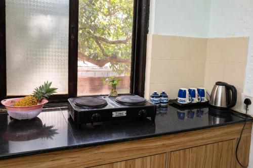 Køkken eller tekøkken på RR Haus Candolim 2BHK Near Hyatt Centric