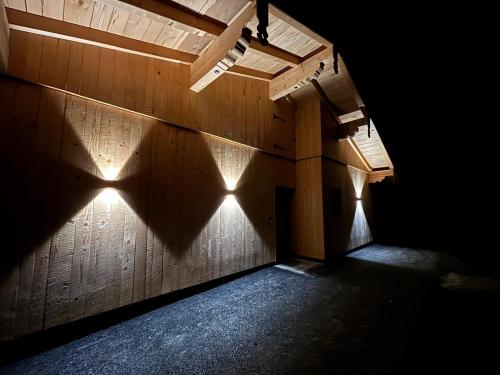 a dark room with lights on the wall at Apartment Bichlhof in Brixen im Thale