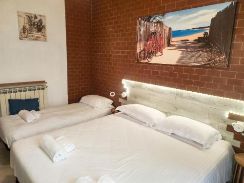 En eller flere senge i et værelse på Bike house Stelvio