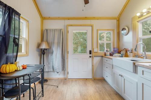 a kitchen with a table with a pumpkin on it at Charming Tiny Home Studio Sleeps 2 - Grill - Porch in Maynardville