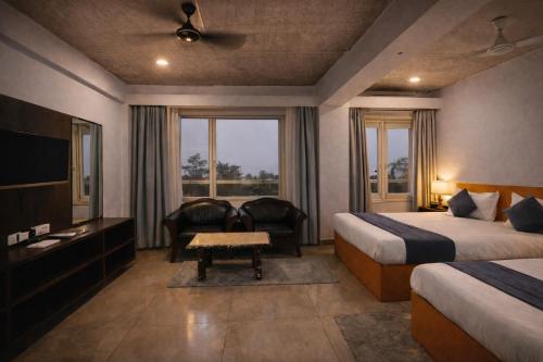 En eller flere senge i et værelse på Ramma TheHotel - 200 mtrs from Nakki Lake