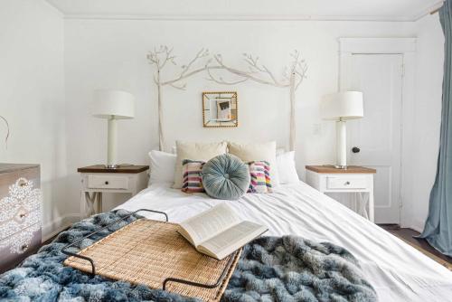 a bedroom with a bed with a book on it at Lucky Leopard in Atlanta