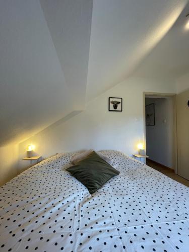 En eller flere senge i et værelse på Appartement de montagne - Station du Schnepfenried