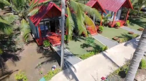 an aerial view of a house with a flooded yard at Homestay Xóm Quê in Ấp Thành Hòa