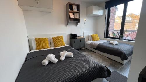 En eller flere senge i et værelse på Southern Sun