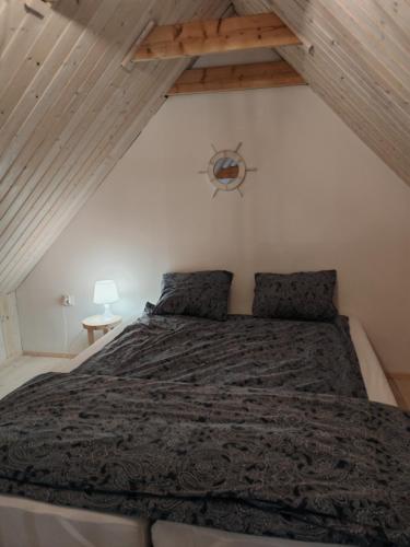 En eller flere senge i et værelse på Domek Morze