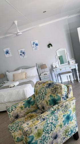 En eller flere senge i et værelse på Aflica Apartments