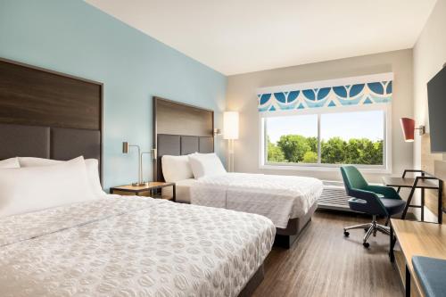 En eller flere senge i et værelse på Tru By Hilton Martinsburg