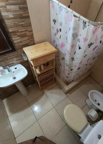 a bathroom with a sink and a toilet at Monoambiente in Mar de Ajó
