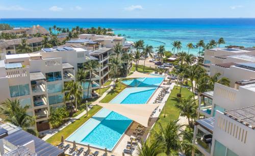 an aerial view of the resort and the beach at Ocean View Condo - 2 Bedrooms - at The Elements Condos - Castillo de Arena in Playa del Carmen