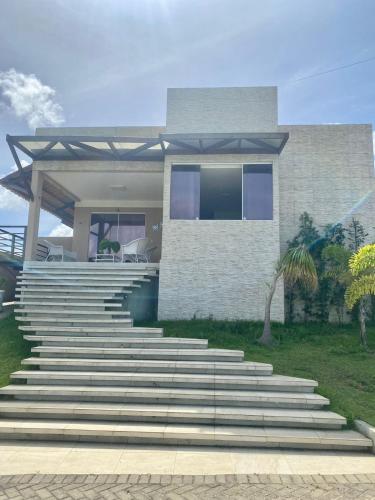 a house with stairs in front of it at Casa Campos do Mar in Conde
