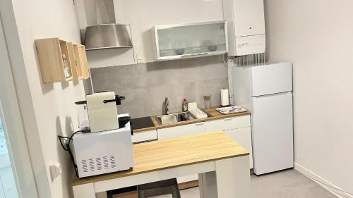 Kuchyň nebo kuchyňský kout v ubytování Résidence Jaude - Appartements Cosy en centre ville