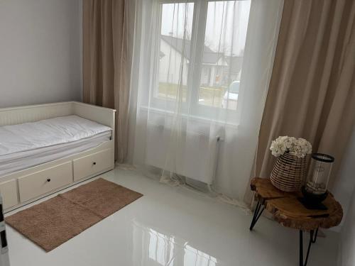 Ein Bett oder Betten in einem Zimmer der Unterkunft Łagowski Zakątek z Sauną