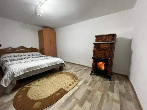 En eller flere senge i et værelse på Casa Putna