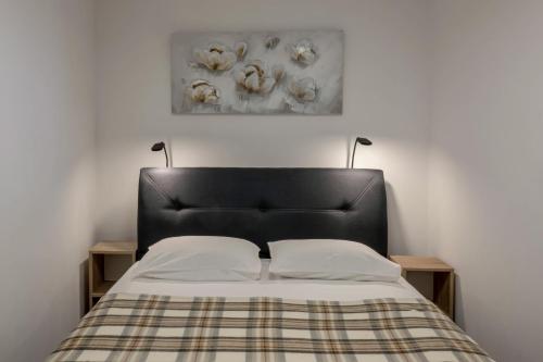 En eller flere senge i et værelse på Casa Romina Višnjan