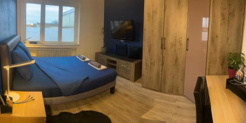 Et tv og/eller underholdning på Chambre rénovée dans appartement de 70m2