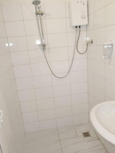 a bathroom with a shower and a sink at GuestHouse3 Karma369 in Plovdiv