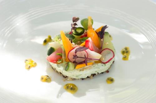 a piece of food on a white plate at Romantik Hotel & Restaurant Sternen in Kriegstetten