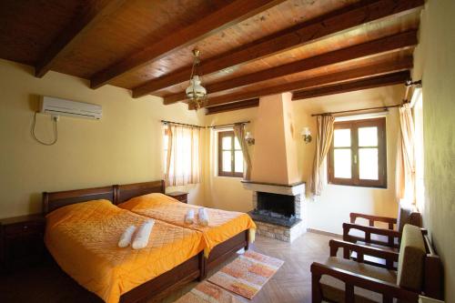 En eller flere senge i et værelse på Piges Hotel