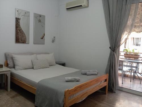 En eller flere senge i et værelse på Nataliya's Nafplio apartment