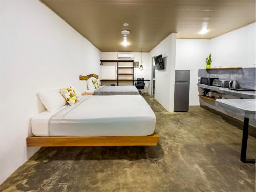 Postel nebo postele na pokoji v ubytování Nomad Living CR Tárcoles